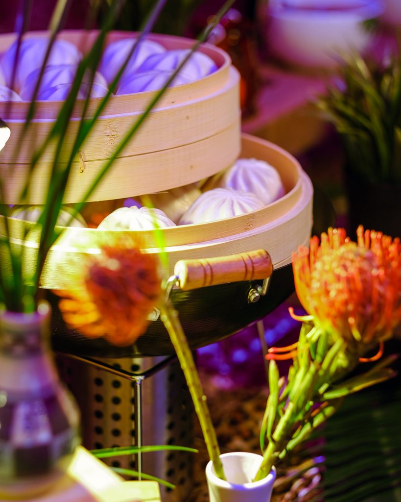 South Pacific culinary station with bamboo steamers at a large event at Armature Works
