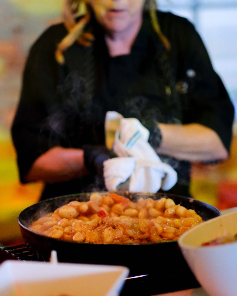Good Food chef preparing pasta at a large event at Armature Works