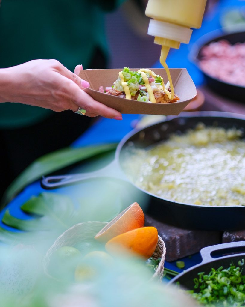Good Food chef preparing an interactive Cuban Fries station at Armature Works