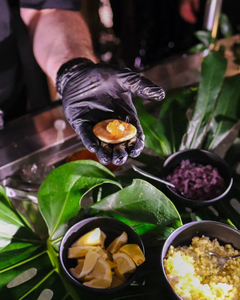 Chef preparing caviar blinis at The Floridian Social