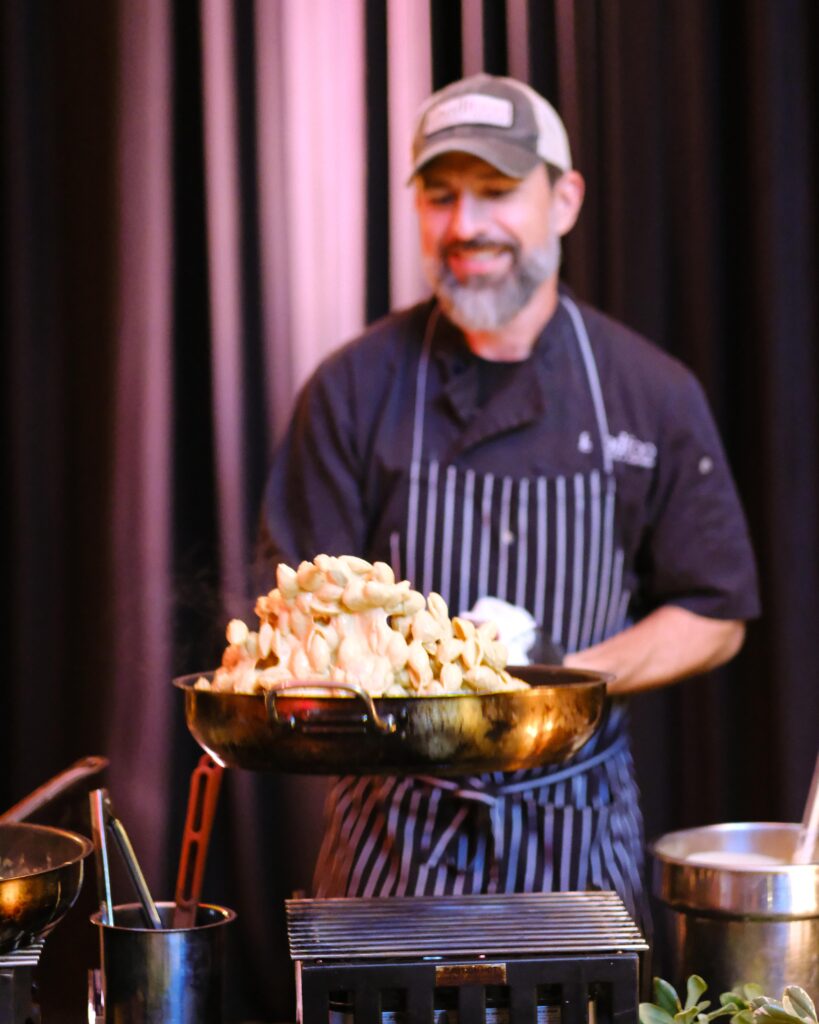 Pasta action station at a New Orleans themed gala catered by Good Food Events + Catering in Tampa