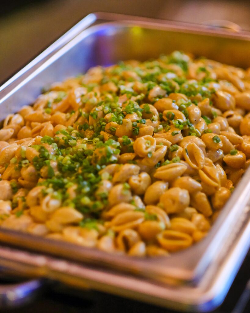 Pasta action station at a New Orleans themed gala catered by Good Food Events + Catering in Tampa